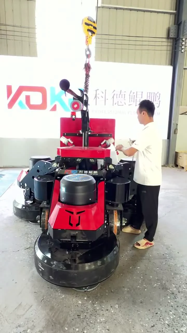 Worker assembling a KDKP floor grinding machine in the workshop